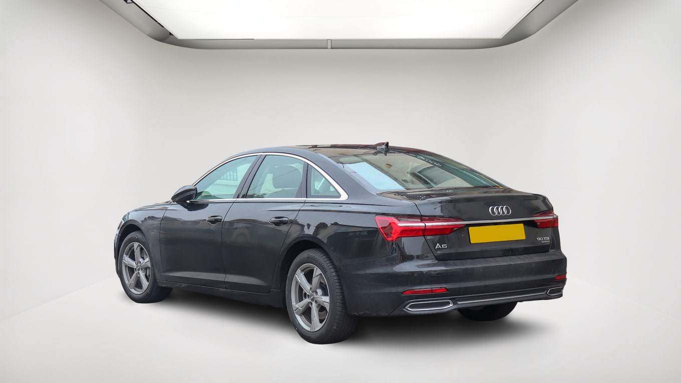 Edited rear-corner Audi photo in the same light studio as the front view, with reflections on the body and rear window